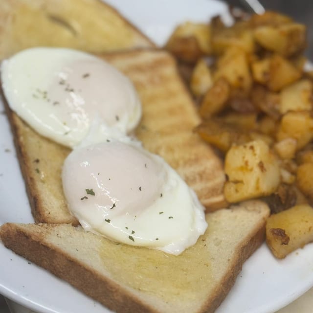 Two Poached Eggs with Home Fries and Toast.